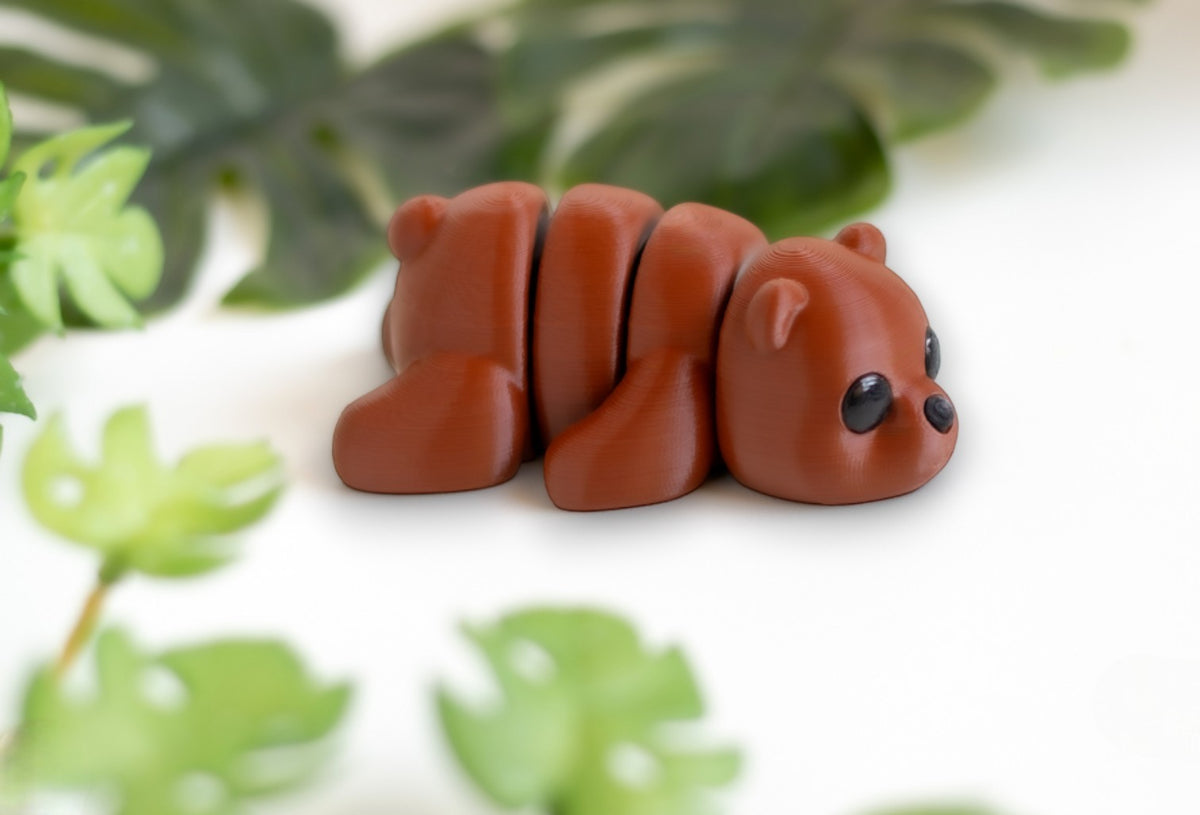 Brown flexible bear figurine with poseable limbs