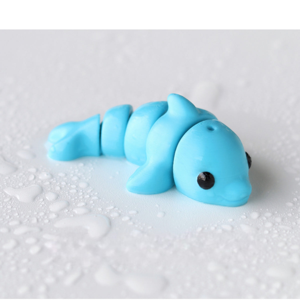 Gray flexible dolphin figurine with curved body