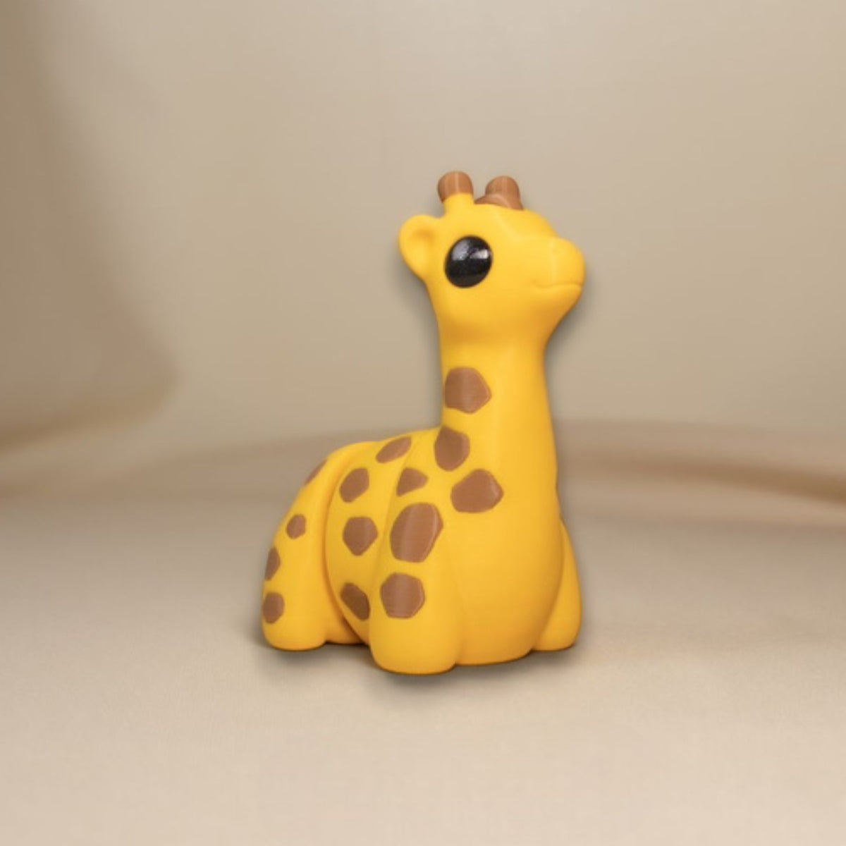 Yellow flexible giraffe figurine with long articulated neck