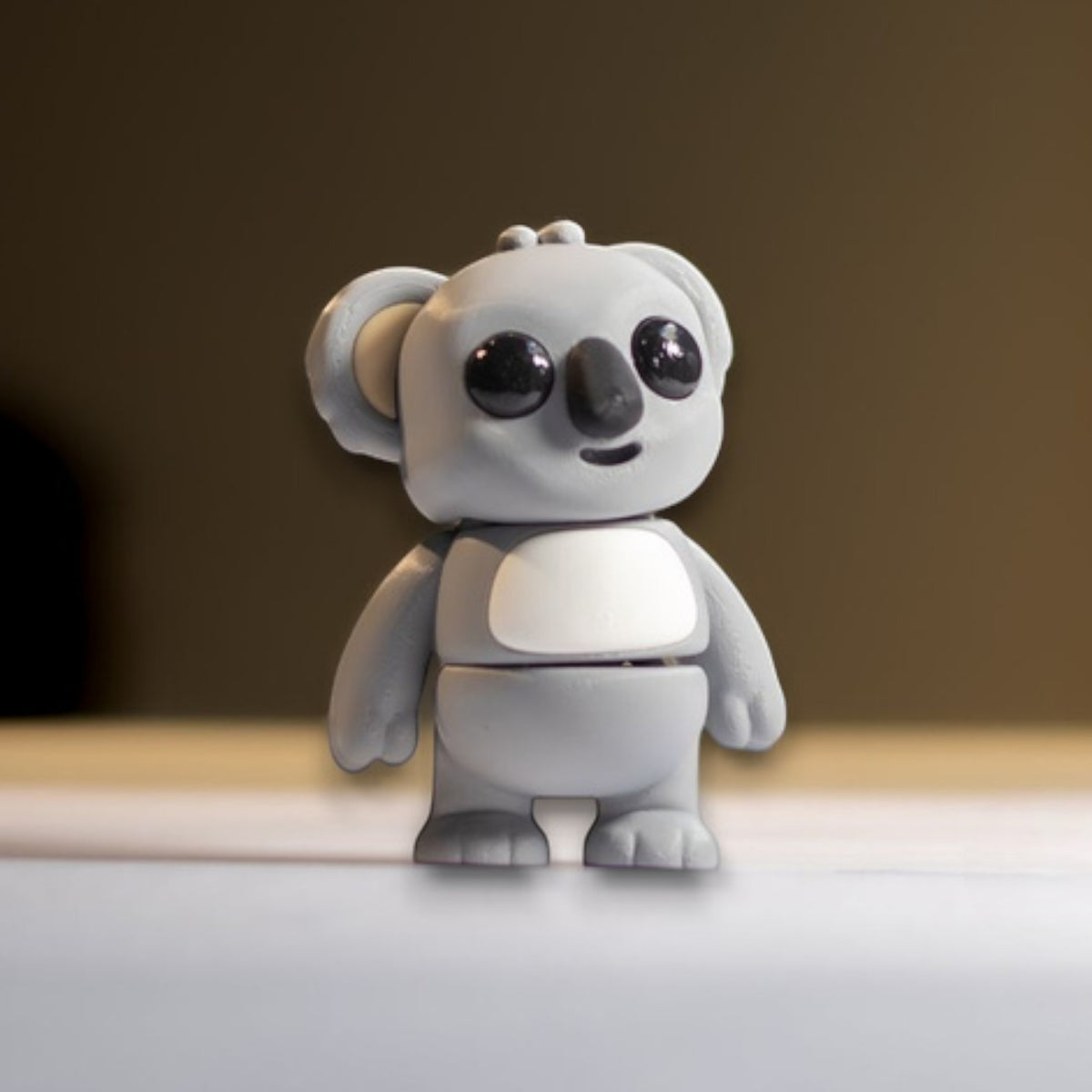 Gray flexible koala figurine clinging pose
