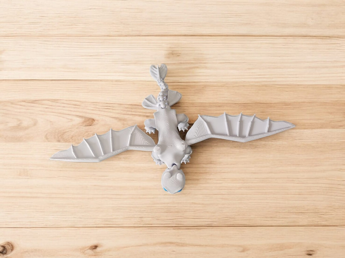 Side view of Light Fury dragon showing sleek flexible design