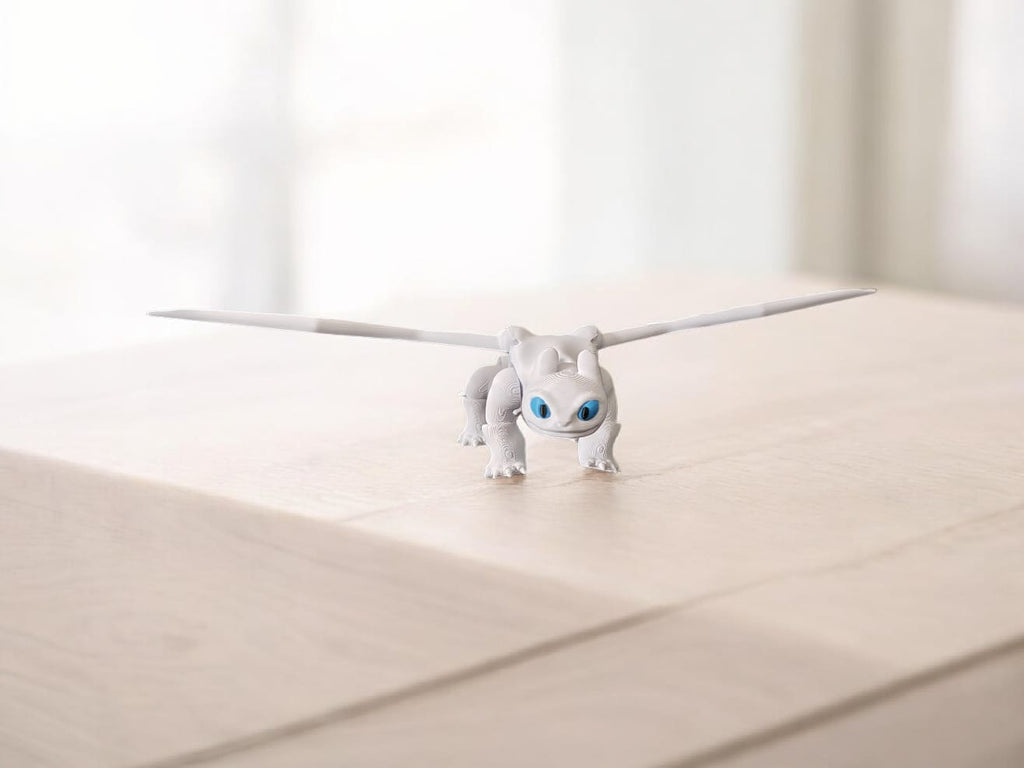 White articulated Light Fury dragon with elegant wings