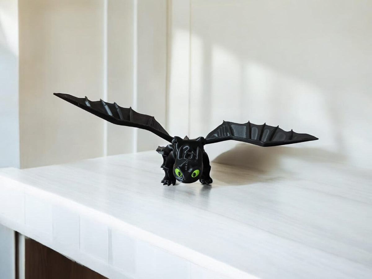 Black articulated Toothless dragon collectible with wings